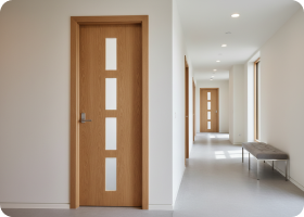 Hallway of doors with staggered cutouts