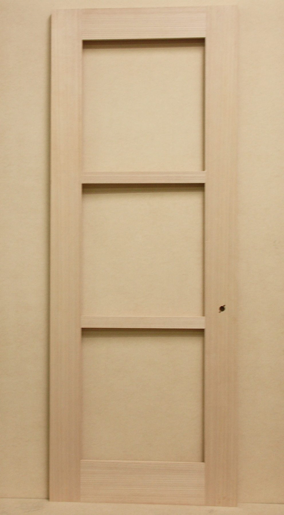 Anigre three-lite door laid out as a sketch face for a stile and rail look