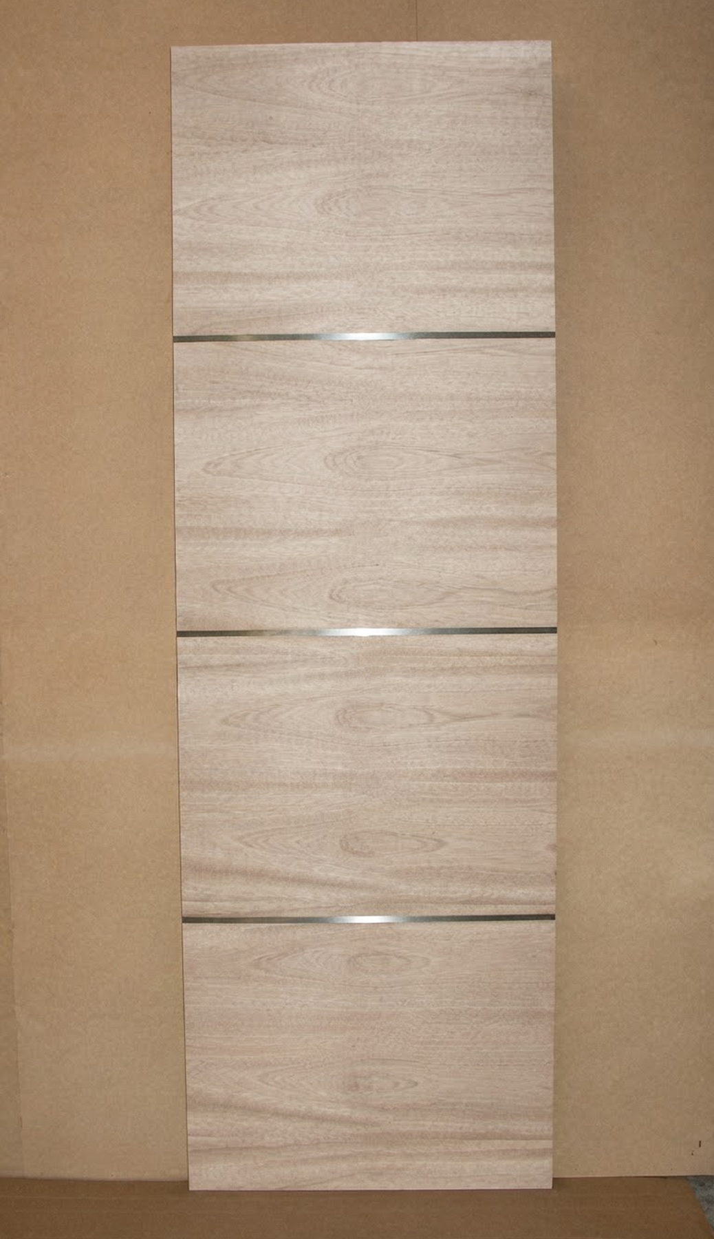 Horizontal red oak veneer door with stainless steel inlay strips