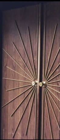 Pair of walnut doors with metal starburst inlays